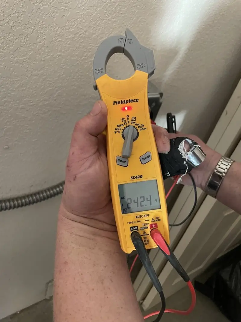 Voltage testing with clamp meter during Hot Tub / Pool Electrical Wiring in Stratford